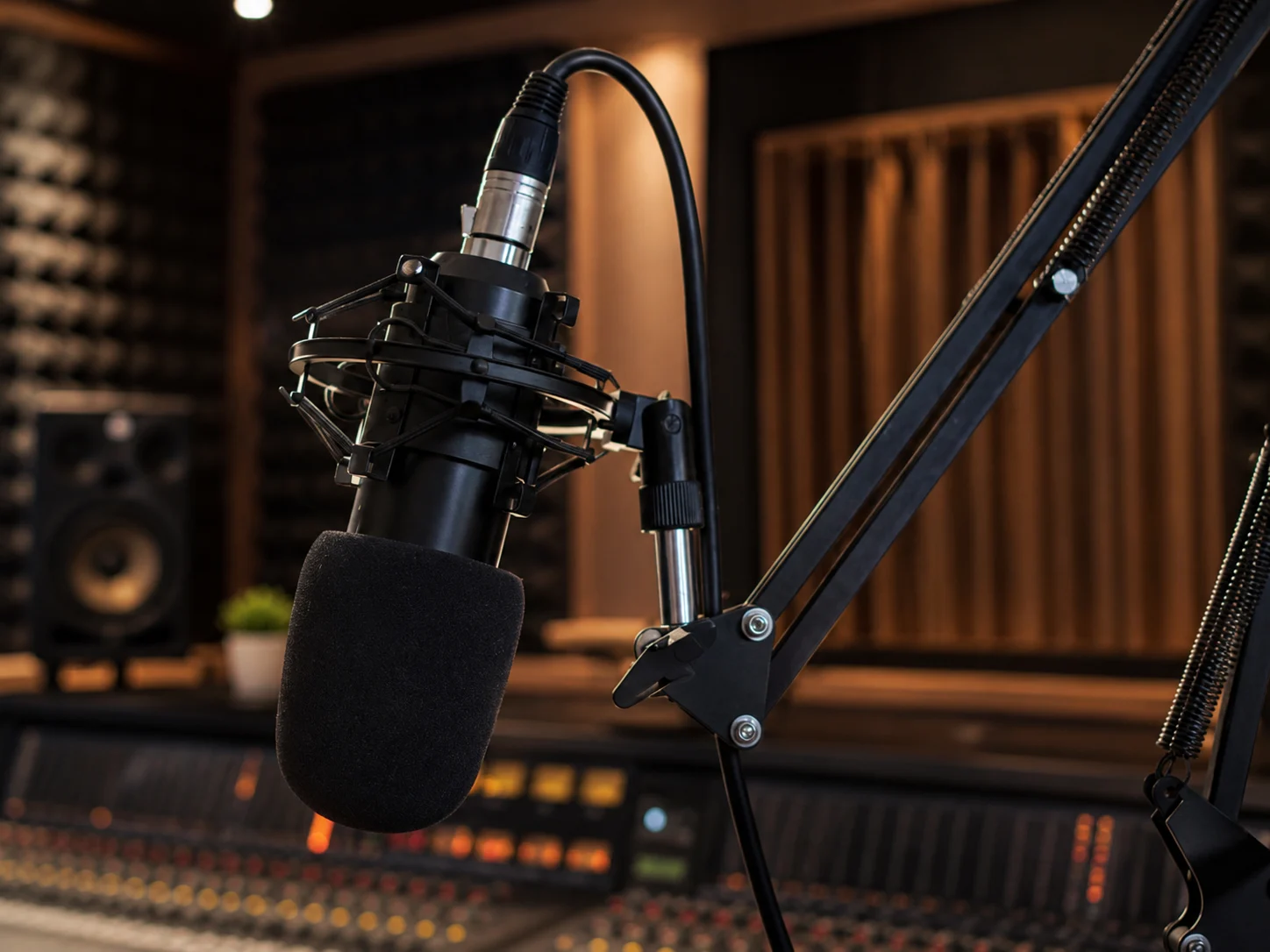 A podcast microphone in a recording studio