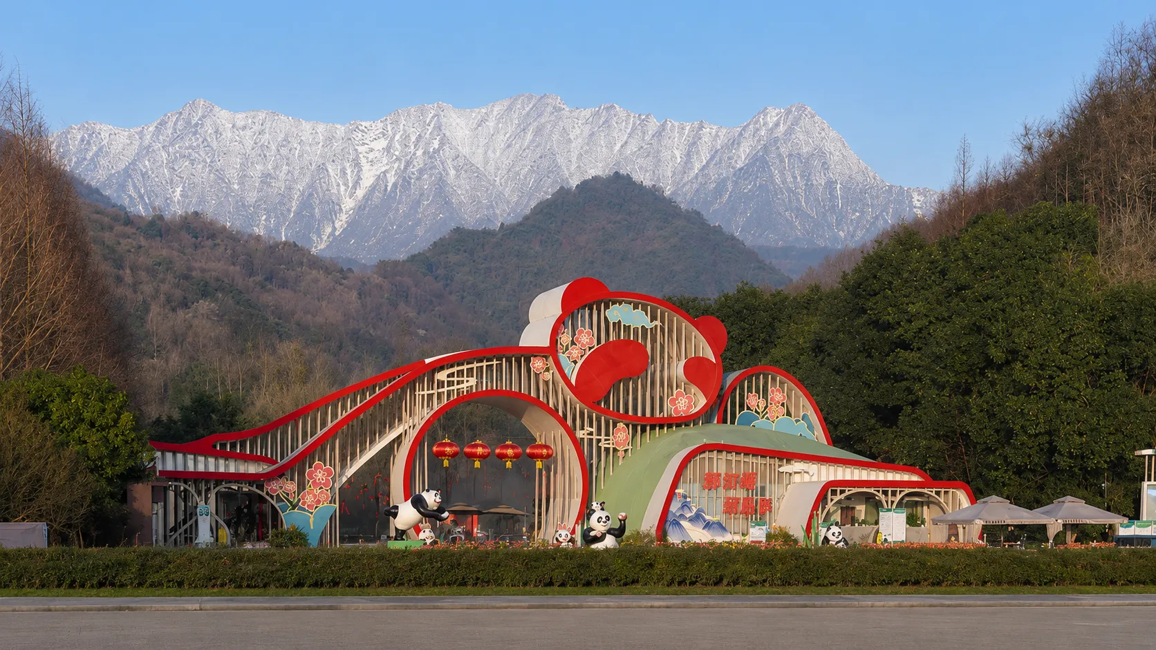 A wide view of the Chengdu Research Base with panda enclosures set among dense bamboo groves