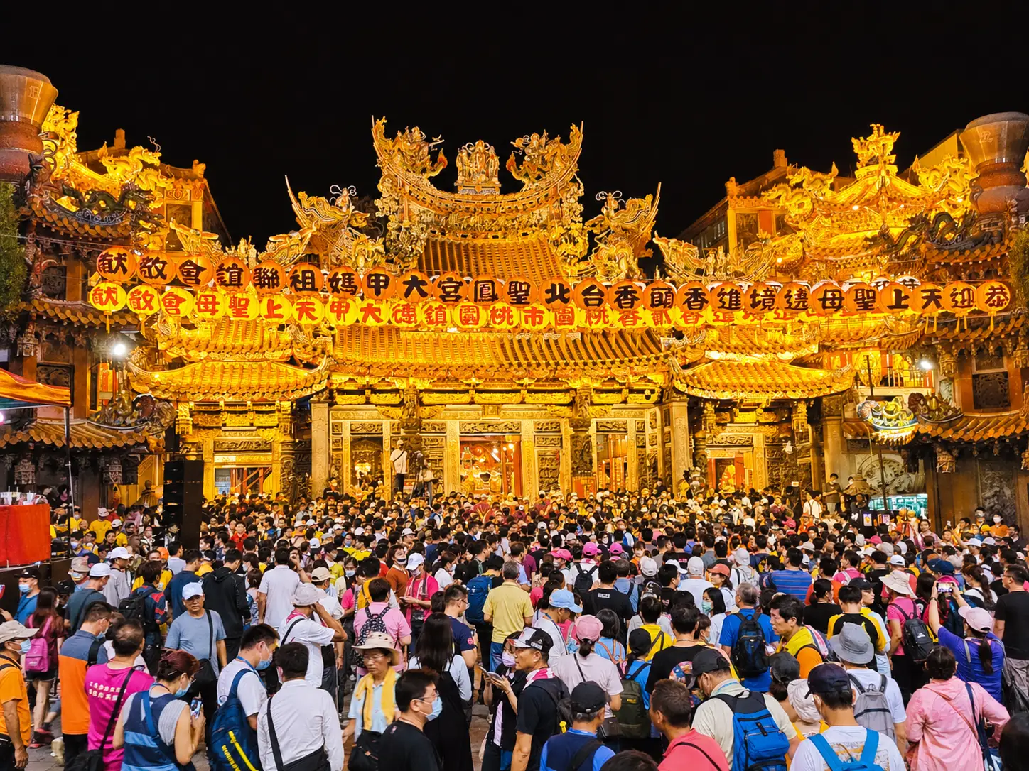 A grand Mazu procession with palanquin carriers