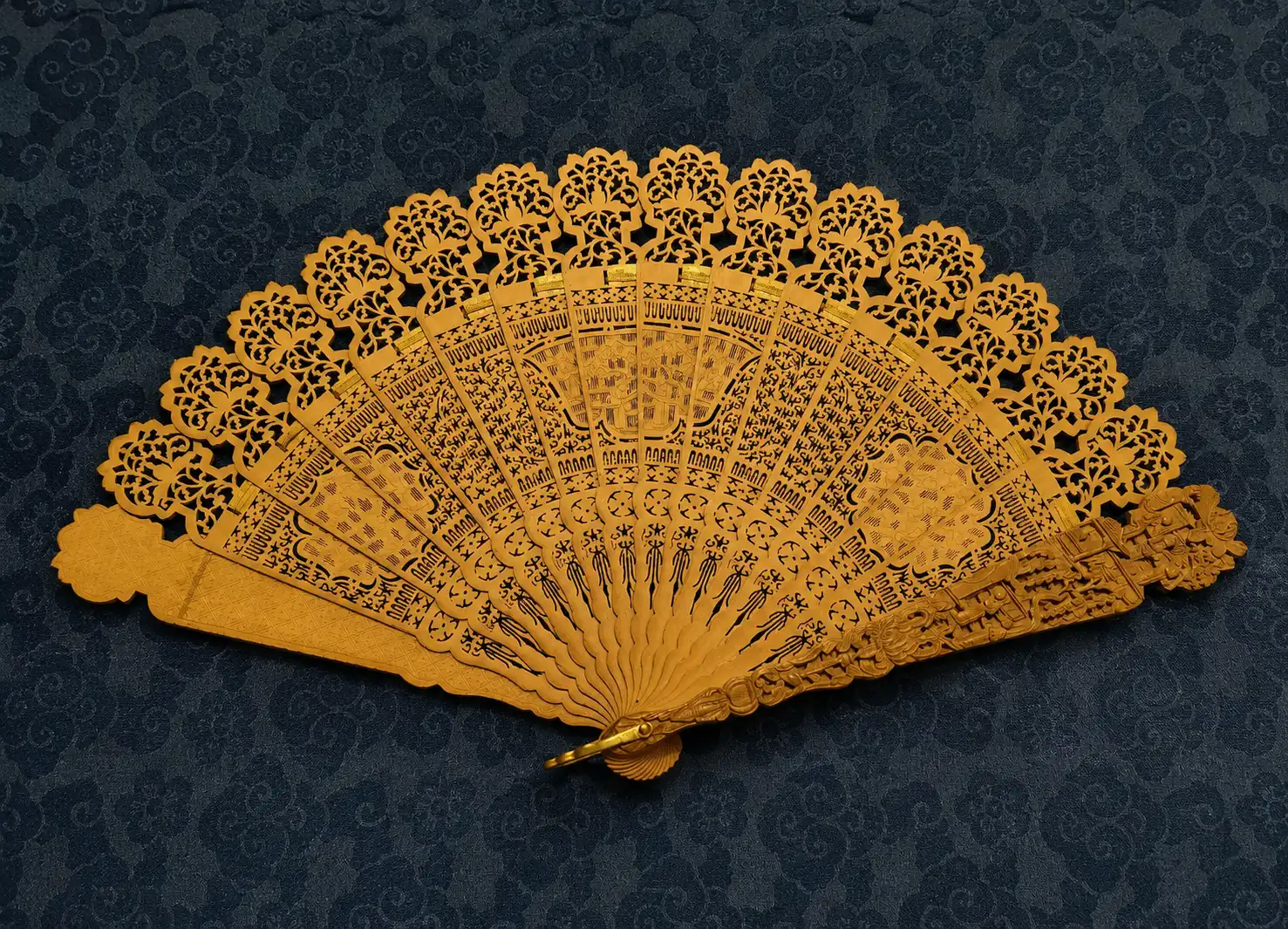 A carved wooden fan from the Qing dynasty