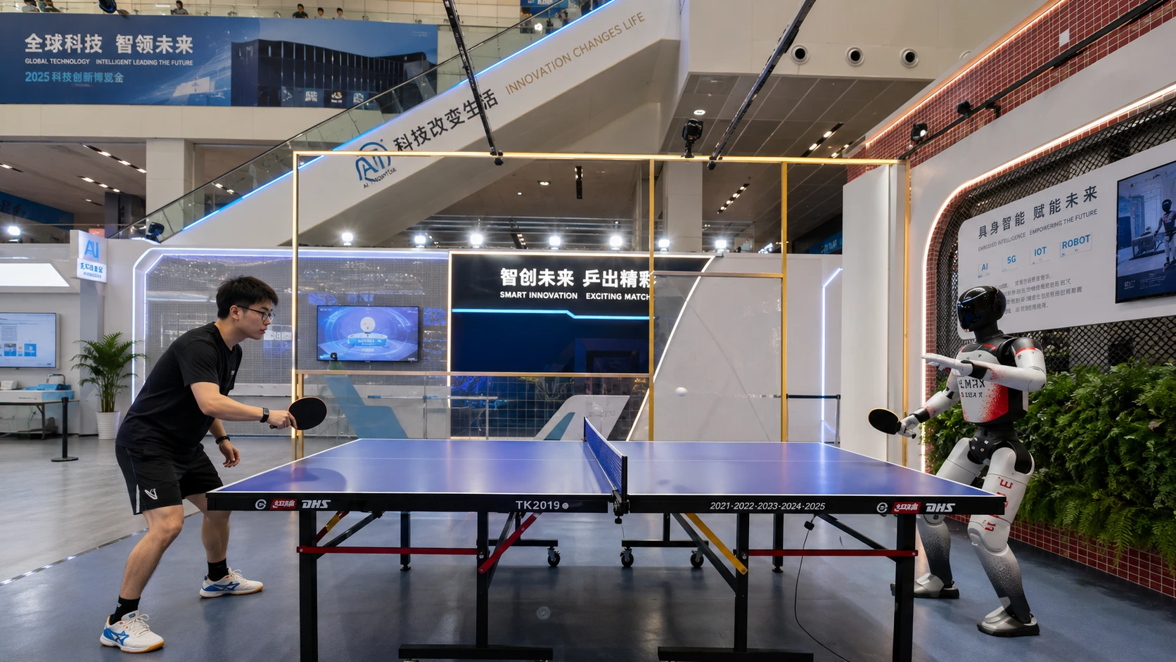 Two humanoid robots face off across a ping pong table mid rally