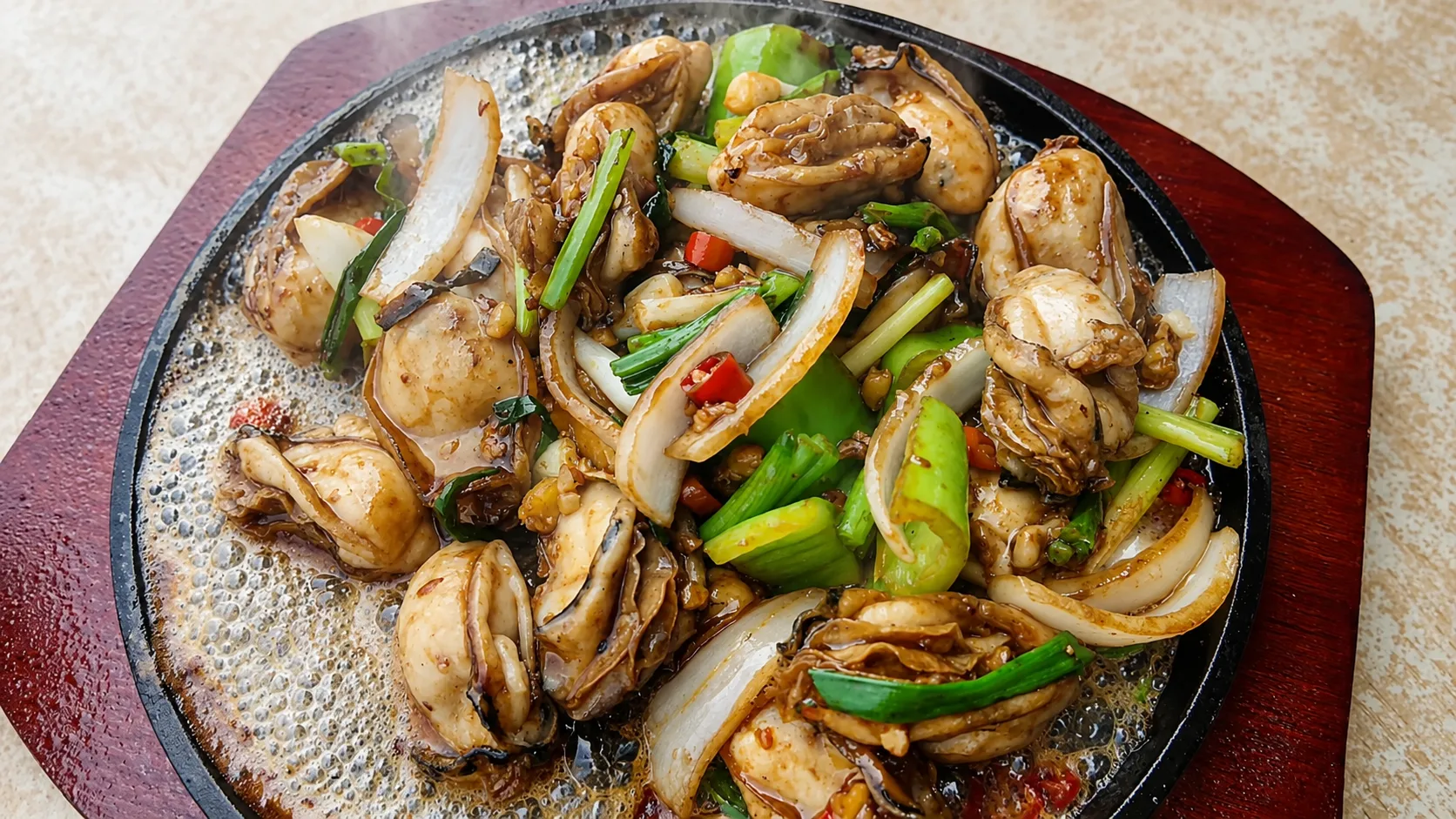 Sizzling oysters on a hot iron plate