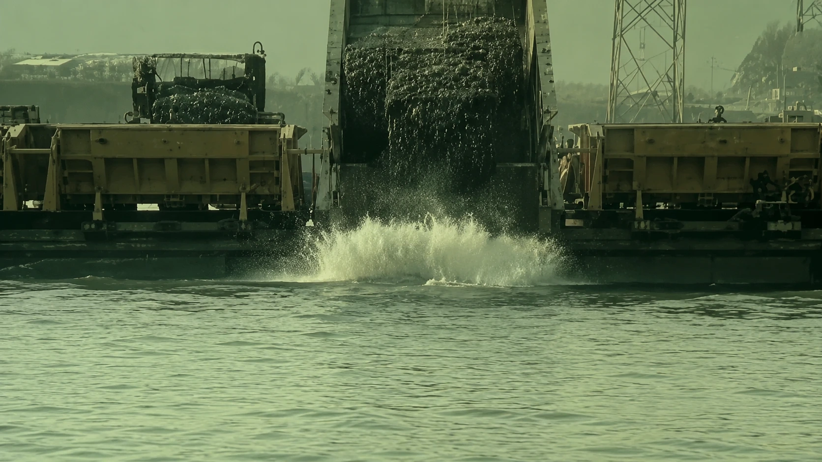 Trucks dumping rocks into the Yangtze to divert its flow