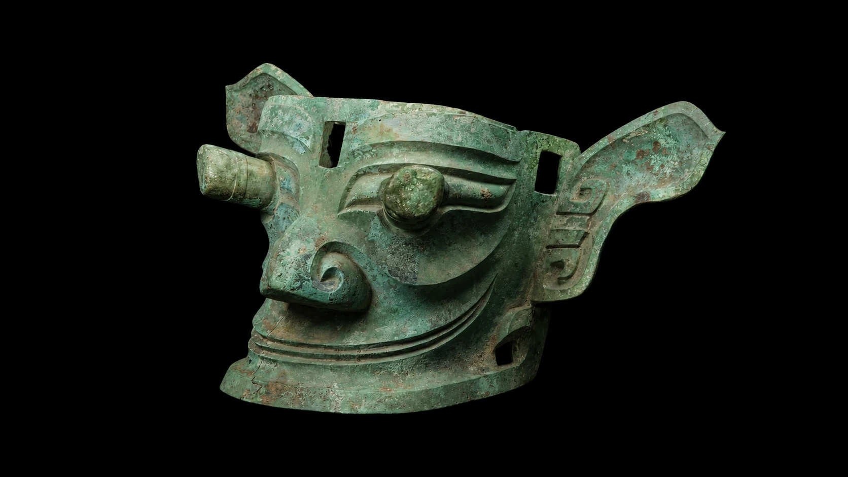 A bronze mask with bulging, protruding eyes and large, fan-shaped ears from the Sanxingdui site