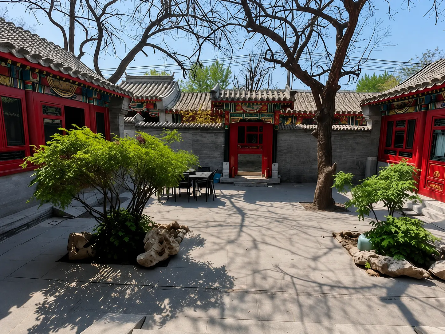 A traditional Beijing siheyuan courtyard seen from above, with rooms arranged around a central open space
