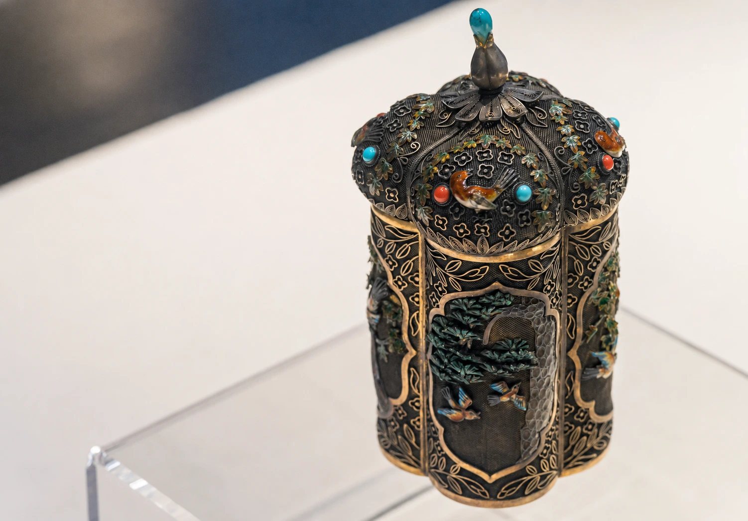 A Qing silver jar with enamel pine and bird motifs