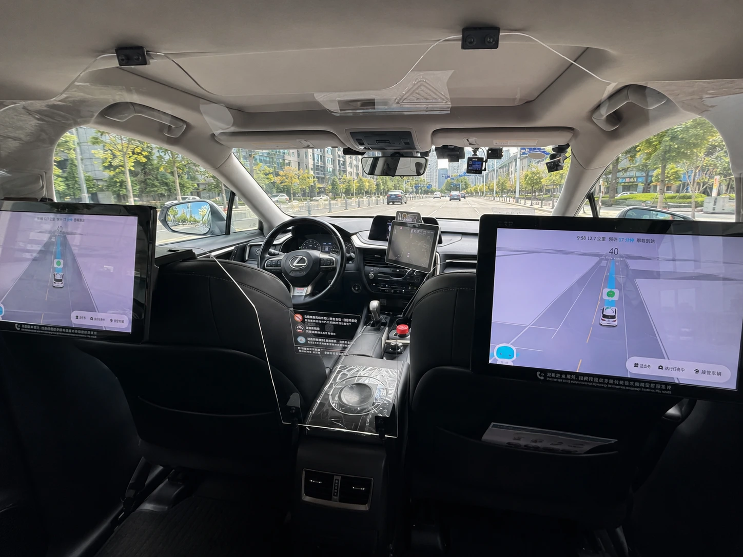 White SUV driverless taxi shown on a ride-hailing screen