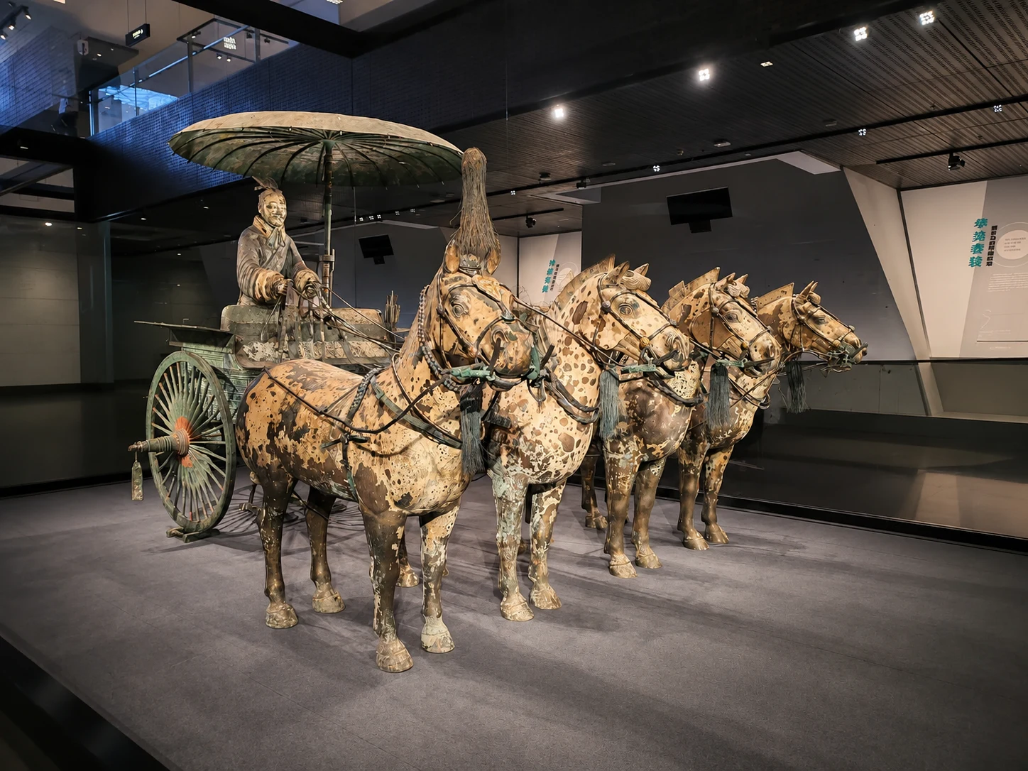 Terracotta horses and chariots unearthed alongside warrior figures in the Xi'an excavation pits