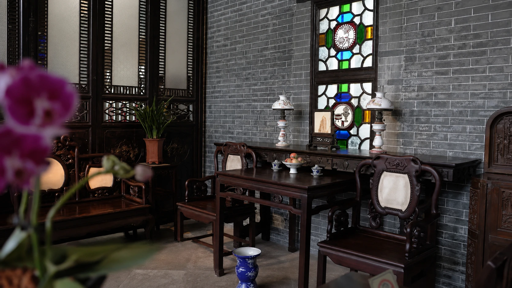Sparse wooden furniture and plain whitewashed walls